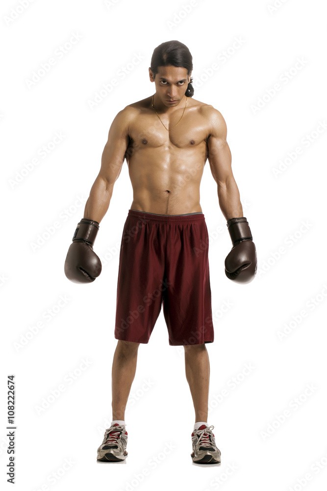 shirtless man wearing gloves
