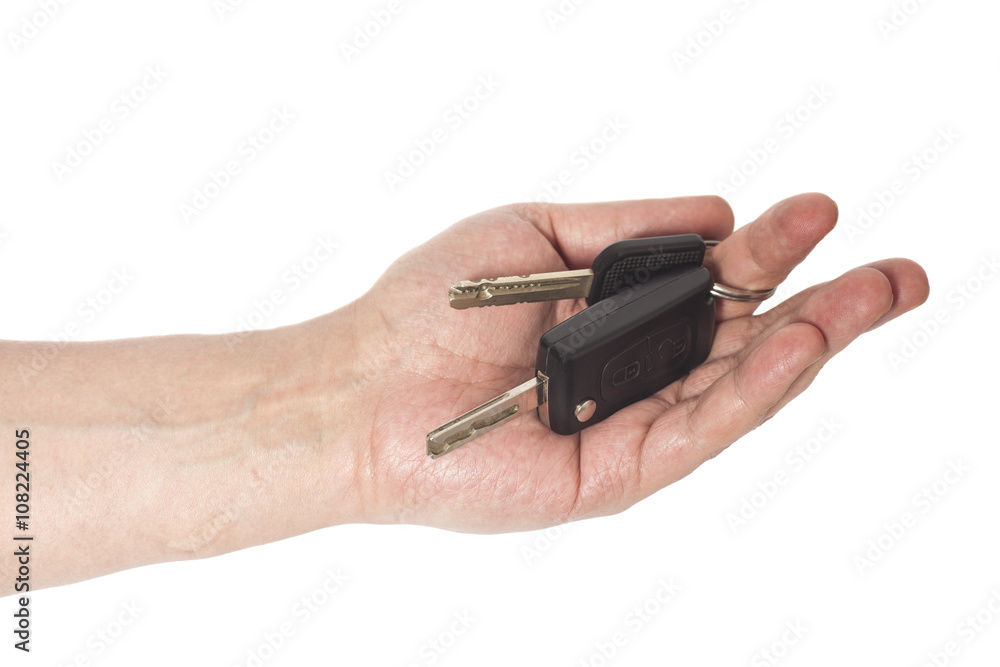 Hand with a car keys isolated on white background Hand with a car keys isolated on white background