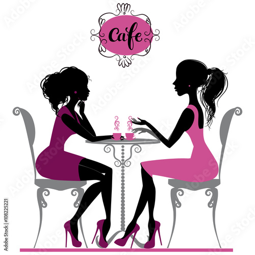 Two girls  in cafe