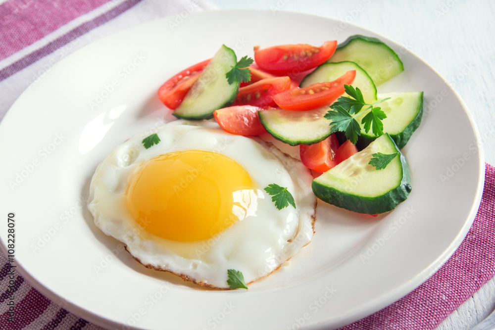 Fried egg with vegetable salad Fried egg with vegetable salad