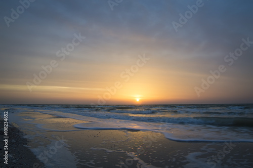 Beautiful sunrise at sea  waves  beach
