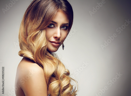 Beautiful blonde woman with long, healthy , straight and shiny hair. 