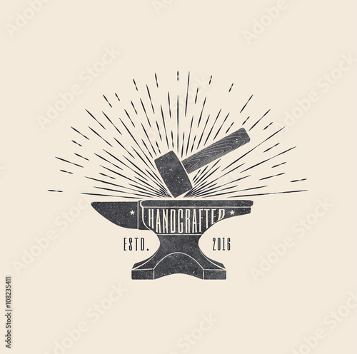 Handcrafted. Vintage styled vector illustration of the hammer and anvil photo