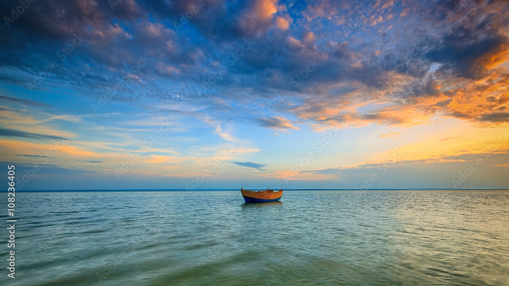 Lonely boat on the Baltic Sea at sunset. HDR - high dynamic range - obrazy, fototapety, plakaty 