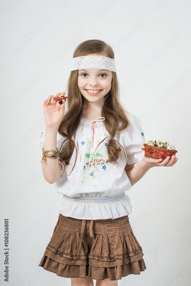 Smiling little girl with basket full of colorful easter eggs Smiling little girl with basket full of colorful easter eggs