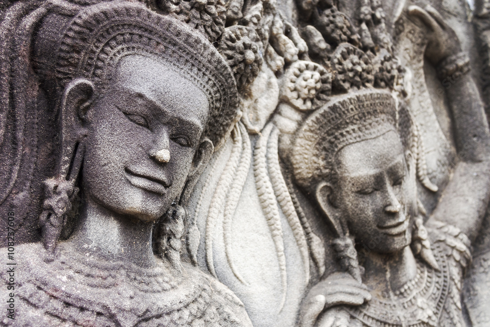 Bas relief carving of Apsaras on Angkor Wat temple, Siem Reap, Cambodia.