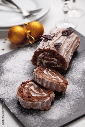 Yule log cake on a Christmas table
