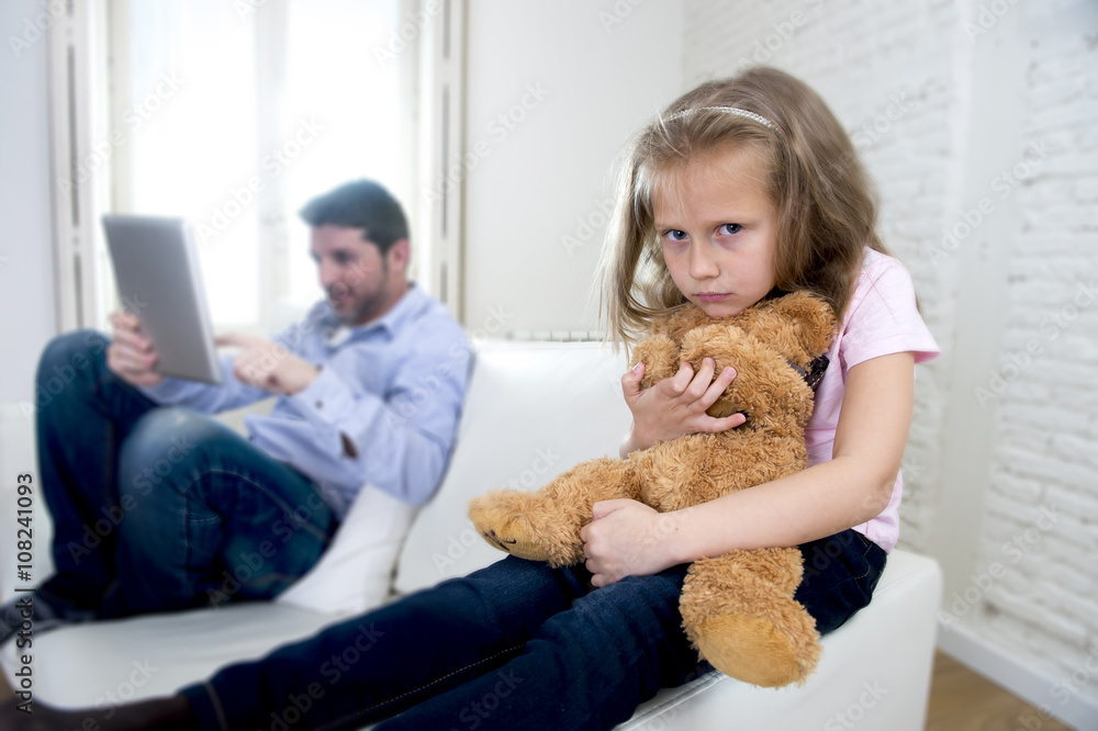 internet addict father using digital tablet pad ignoring little sad daughter bored hugging teddy bear internet addict father using digital tablet pad ignoring little sad daughter bored hugging teddy bear