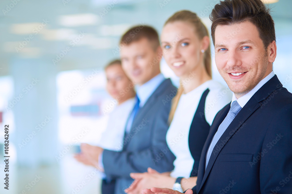Smiling business people applauding a good presentation in the office Smiling business people applauding a good presentation in the office