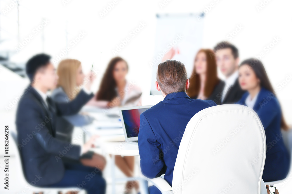 Young colleagues sitting at the business meeting in the office Young colleagues sitting at the business meeting in the office