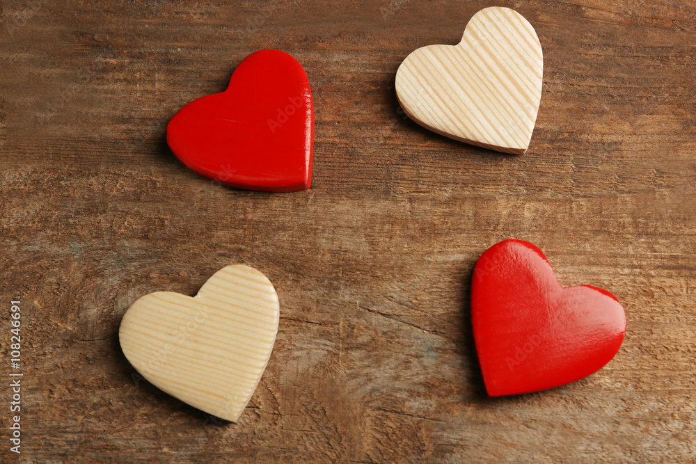 Obraz premium Wooden hearts on rustic wooden background