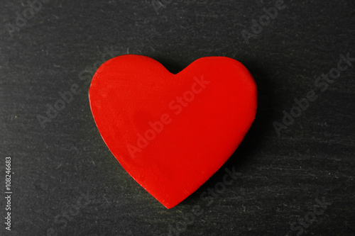 Wooden heart on dark background