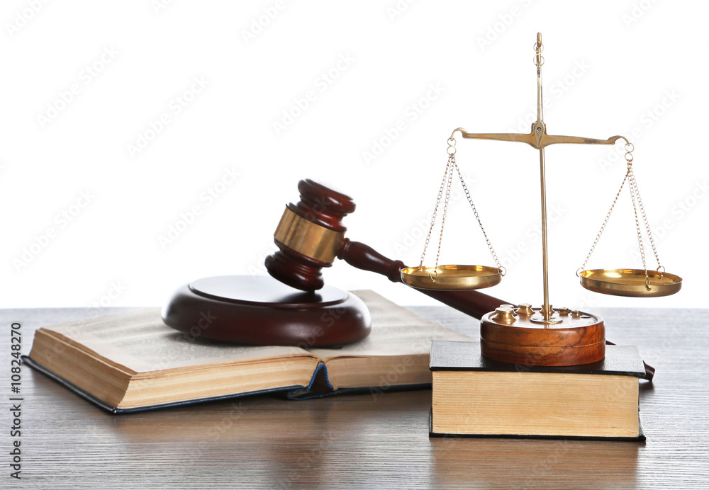 Wooden gavel with justice scales and books on white background Wooden gavel with justice scales and books on white background