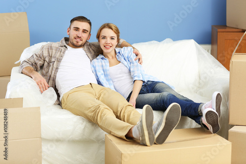 Happy young couple moving i...