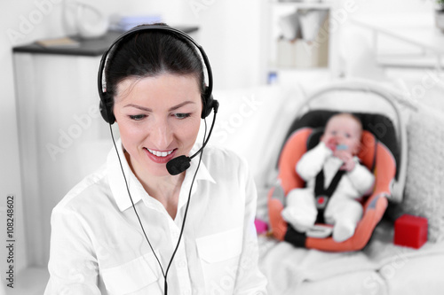 Businesswoman with baby boy...