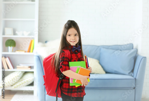 Little girl with red back p...