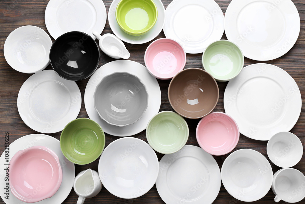 Empty dishes on wooden background. Empty dishes on wooden background.