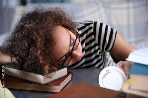 Tired beautiful girl sleepi...