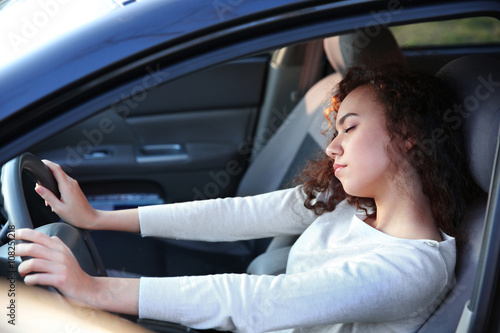 Woman sleeping in car