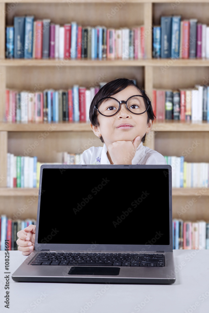 Student thinking idea with laptop in library Student thinking idea with laptop in library