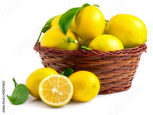 Lemons in basket isolated on white