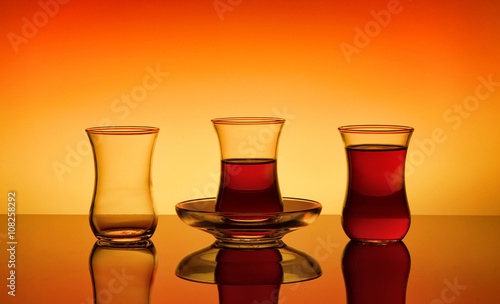 Three turkish glasses on a orange background