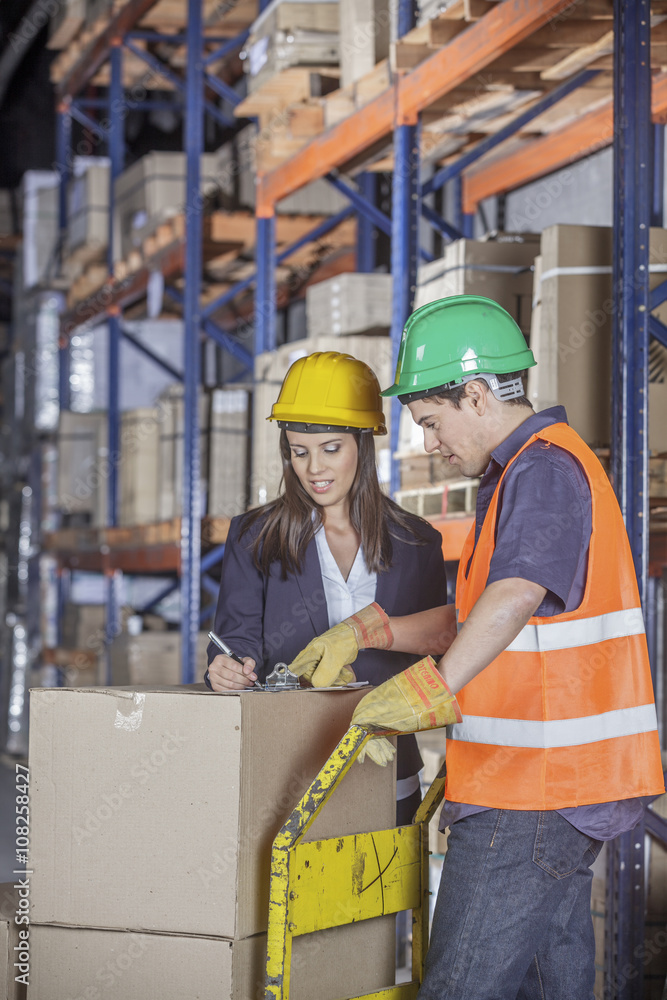 Workers In Warehouse Preparing Goods For shipping Workers In Warehouse Preparing Goods For shipping