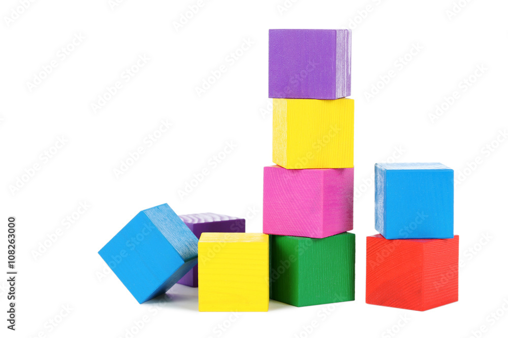Colorful wooden toy cubes isolated on a white Colorful wooden toy cubes isolated on a white