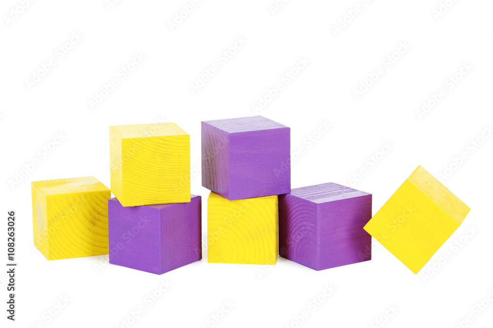 Colorful wooden toy cubes isolated on a white Colorful wooden toy cubes isolated on a white