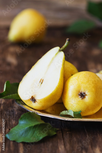 Organic ripe pear in vintage  plate