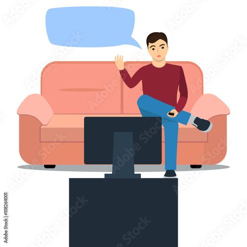 man sits on the couch watching TV and outraged