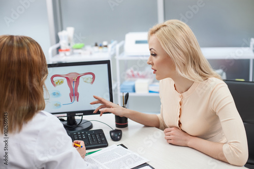 Beautiful blond girl is consulting with gynecologist