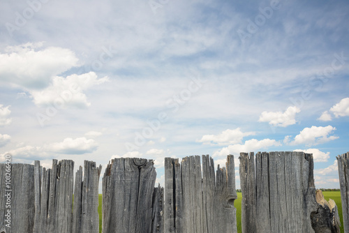 wooden fence and clouds