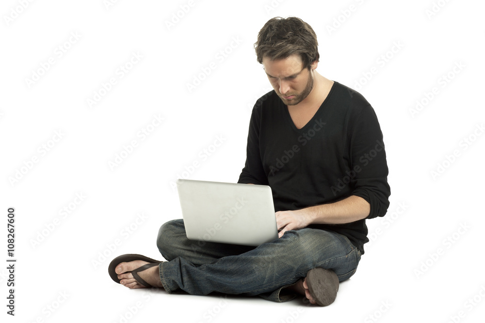 a serious man using a laptop a serious man using a laptop