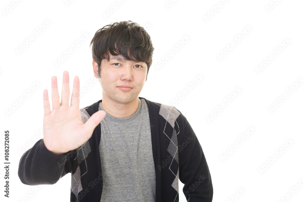 ストップのジェスチャーをする男性