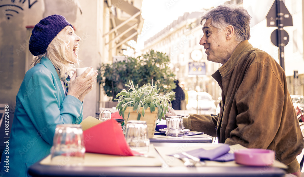 Senior couple having a coffee in a bar Senior couple having a coffee in a bar