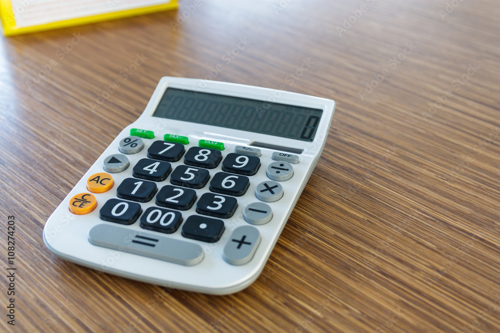 calculator on wood table calculator on wood table