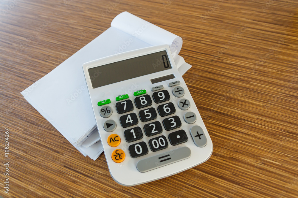 calculator on wood table calculator on wood table