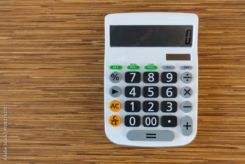 calculator on wood table calculator on wood table
