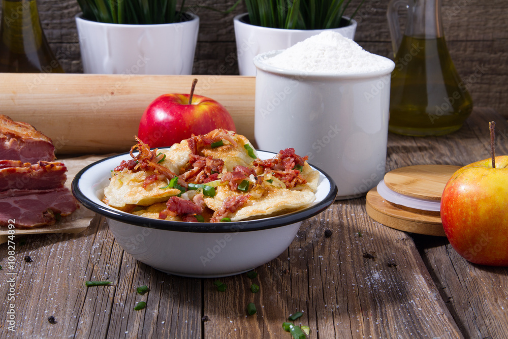 Polish fried dumplings with meat, onion and bacon. Polish fried dumplings with meat, onion and bacon.