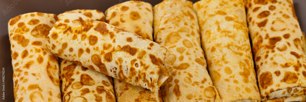 Fototapeta premium Russian Stuffed Blintzes Isolated on White. Selective focus.