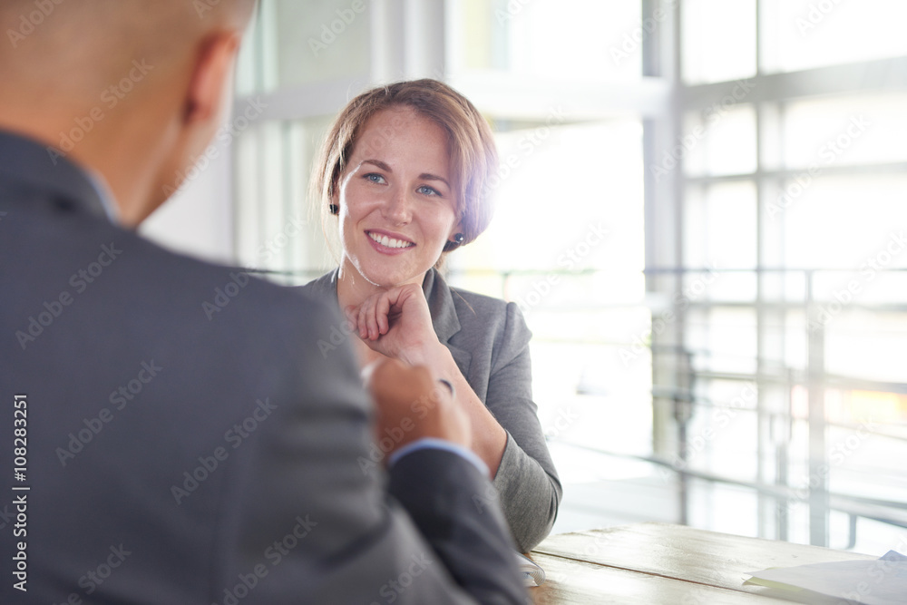 team of successful business people having a meeting in executive sunlit office team of successful business people having a meeting in executive sunlit office