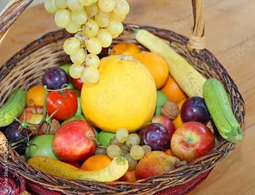 wicker basket with fresh fruit in autumn