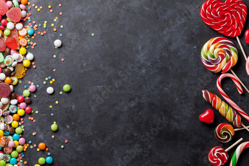 Colorful candies, jelly and marmalade over stone