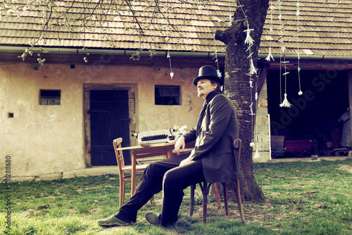 Vintage Outdoor Writer is Writing a Novel Book on Typewriter