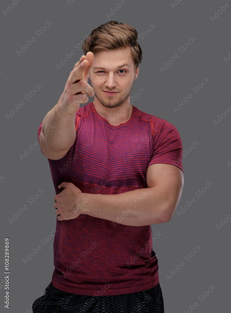 Attractive fit guy in a red t shirt.