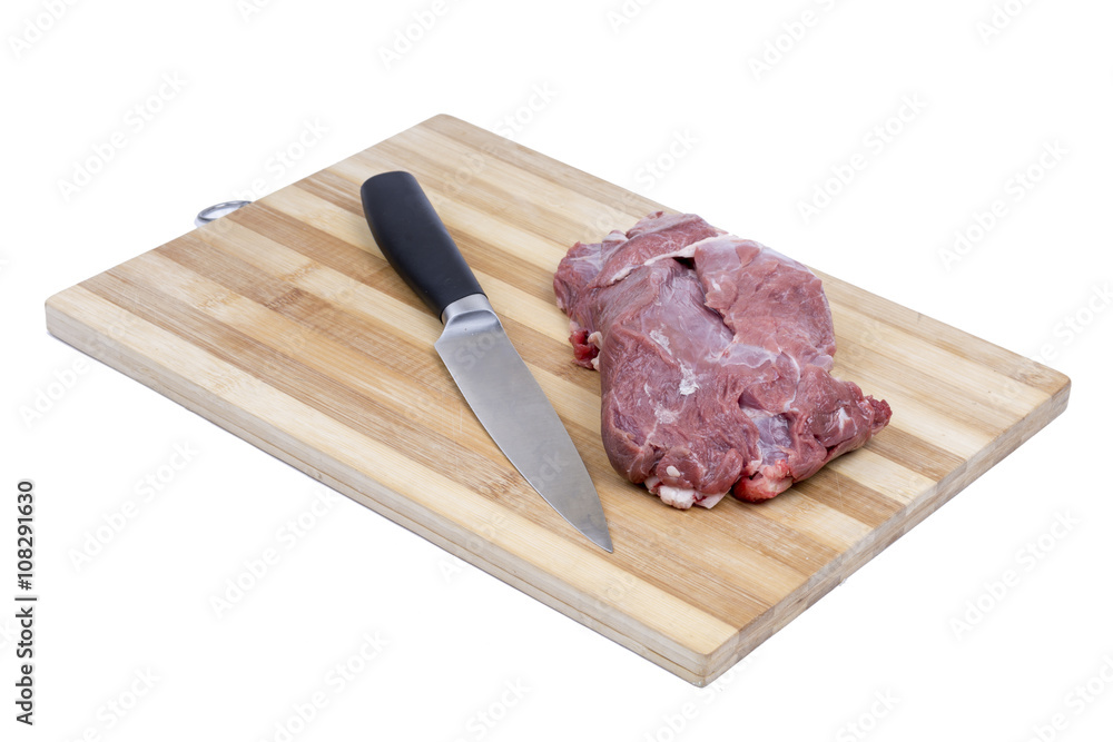 Beef meat with kitchen knife on the cutting board