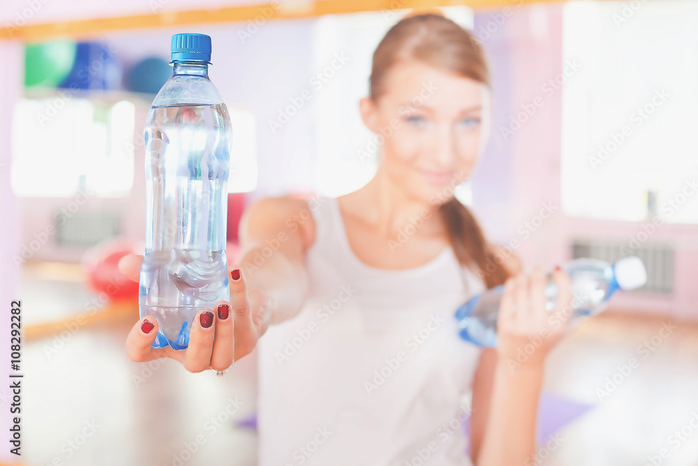 Happy woman fitness exercise holding natural water Happy woman fitness exercise holding natural water