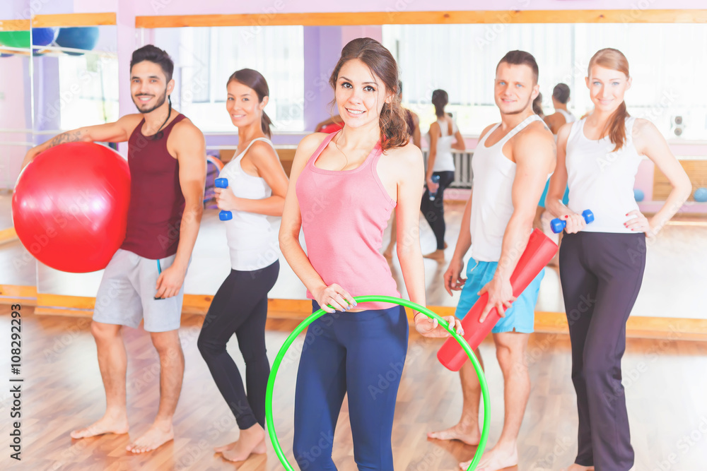 Naklejka premium Young group people lead healthy lifestyle, exercise in fitness r