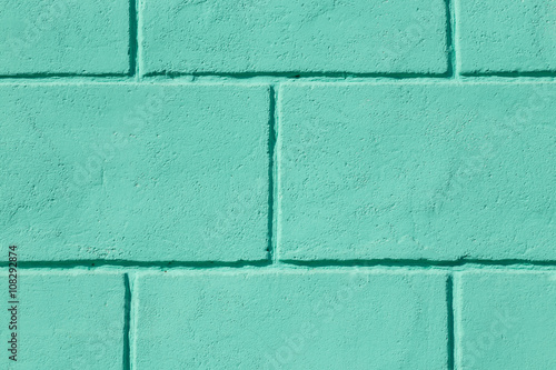 Aged greenl brick wall background